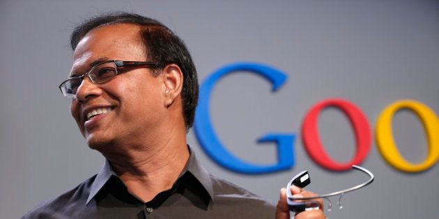 Amit Singhal, formerly senior vice president of search at Google, holds a Google Glass as he speaks at the garage where the company was founded on Google's 15th anniversary in Menlo Park, California September 26, 2013.