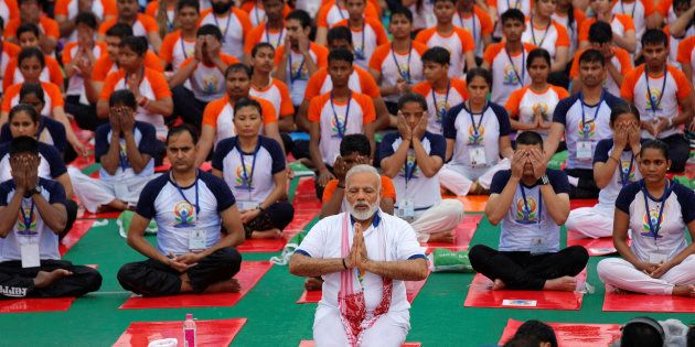 Indian Prime Minister Narendra Modi performs yoga on International Yoga Day in Lucknow, India June 21, 2017. REUTERS/Pawan Kumar