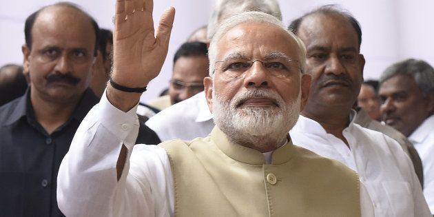 Prime Minister of India Narendra Modi waves his hand after casting his vote during the presidential election, at the Parliament House on July 17, 2017 in New Delhi, India.