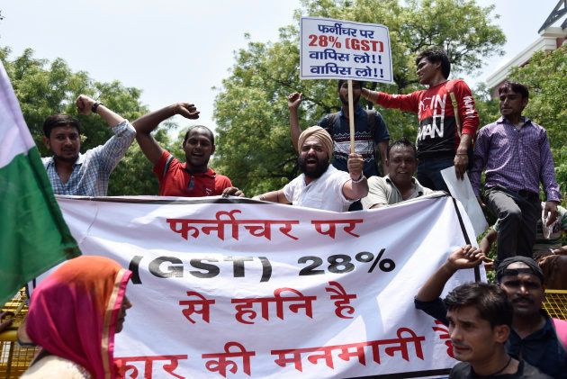 Congress party activists and workers staged a protest march at Jantar Mantar against the implementation of Goods & Services Tax (GST), on July 18, 2017 in New Delhi.