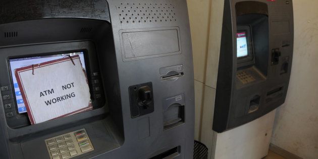 GURGAON, INDIA - DECEMBER 29: After the fifty days of demonetization, no cash in Axis Bank ATM machine in sector-14, on December 29, 2016 in Gurgaon, India. (Photo by Parveen Kumar/Hindustan Times via Getty Images)