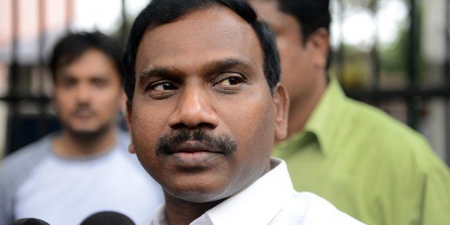 Former telecom minister A. Raja gesture as he interacts with the media following his appearance in connection with the 2G spectrum scam at the CBI court in New Delhi on May 5, 2014.