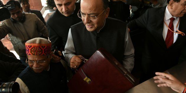 Indian Finance Minister Arun Jaitley (C) arrives at Parliament House to present the Union Budget in New Delhi on February 1, 2018.