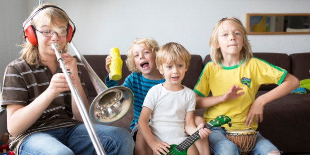 SANKT AUGUSTIN, GERMANY - AUGUST 05: Four brothers at age of three, six, eight and twelve making music together on August 05, 2014, in Sankt Augustin, Germany. Photo by Ute Grabowsky/Photothek via Getty Images)***Local Caption***