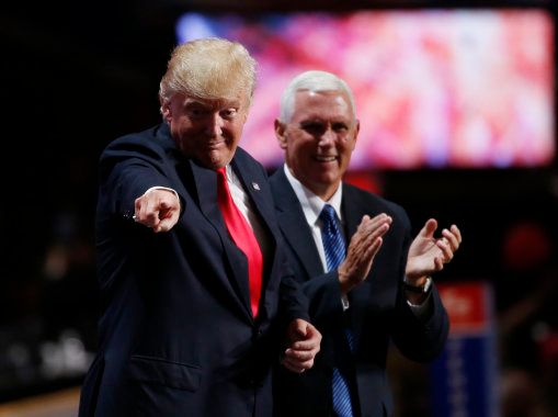 Republican U.S. presidential nominee Donald Trump stands with vice presidential nominee Mike Pence at the Republican National Convention in Cleveland, Ohio, U.S., July 21 2016. REUTERS/Mario Anzuoni