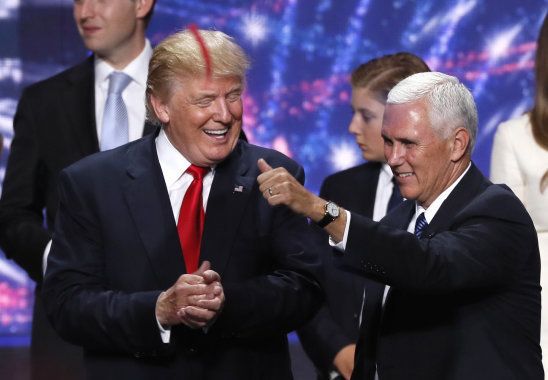 Republican U.S. presidential nominee Donald Trump (L) celebrates with vice presidential nominee Mike Pence at the conclusion of the Republican National Convention in Cleveland, Ohio, U.S. July 21, 2016. REUTERS/Mike Segar