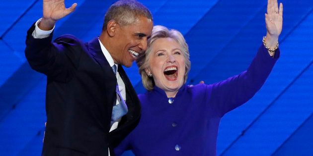 U.S. President Barack Obama and Democratic presidential nominee Hillary Clinton appear onstage together after his speech at the Democratic National Convention, July 27, 2016.