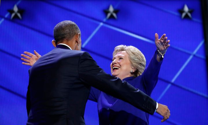 Democratic presidential nominee Hillary Clinton greets U.S. President Barack Obama.