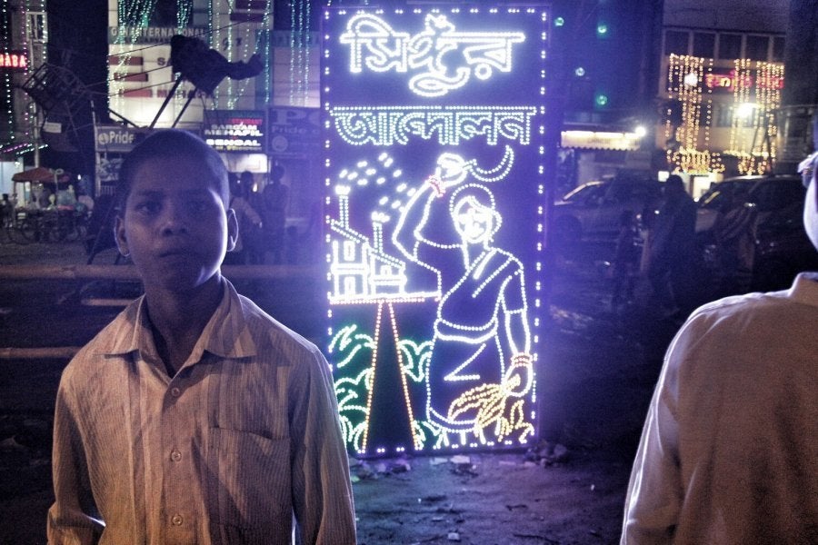 The decorative lighting in one of the pandals in south Kolkata seeks to remind the revellers of the Singur movement - a protest by farmers against the police and erstwhile CPM government, which left 14 people dead.