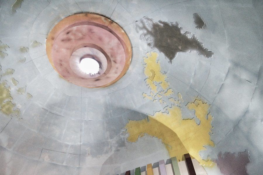 The world map being painted on the ceiling of a pandal in South Kolkata.