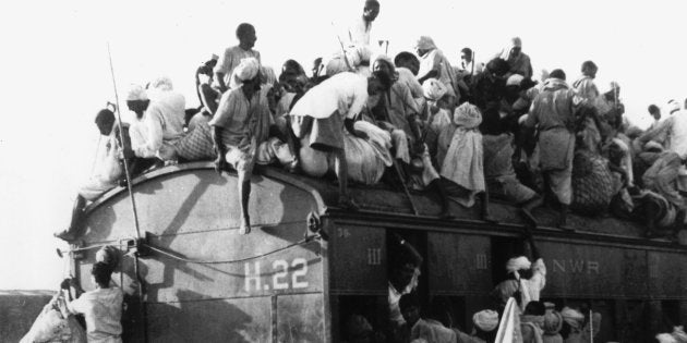 Muslim refugees cram into coaches and the roof of a train bound for Pakistan from New Delhi, India, on 26 September 1947. (AP Photo.)