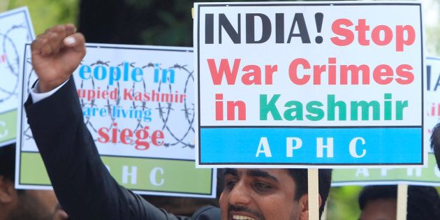 A supporter of All Parties Hurriyat (Freedom) Conference (APHC) chants slogans with others to condemn the violence in Kashmir during a demostration in Islamabad, Pakistan, July 25, 2016.