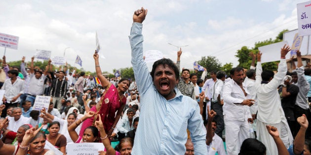 People shout slogans as they attend a protest rally against what they say are attacks on India's Dalit community in Ahmedabad.