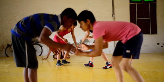 A training session at Balali akhara features both boys and girls. Wrestler sisters Babita and Sangita Phogat come from this village. As many as six girls from their family have won gold medals at various international events. Photo by Pradeep Gaur/Mint via Getty Images)