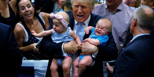 QUALITY REPEAT - Republican presidential nominee Donald Trump holds babies at a campaign rally in Colorado Springs, Colorado, U.S., July 29, 2016. REUTERS/Carlo Allegri TPX IMAGES OF THE DAY