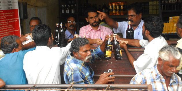 File photo of customers buying Indian Made Foreign Liquor (IMFL) from a shop run by Kerala State Beverages Corporation (KSBC) on Onam Day in Kerala, India.
