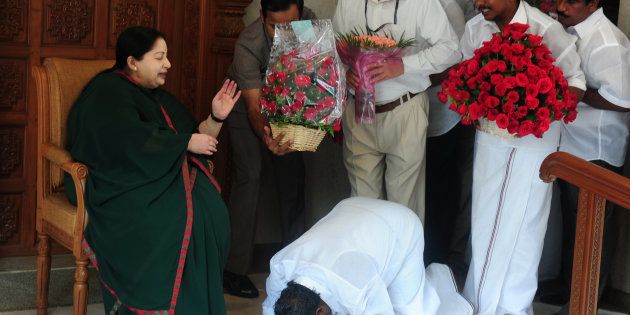 A party cadre prostrates himself at the feet of AIADMK leader Jayalalithaa in Chennai in May 2016.ARUN SANKAR/AFP/Getty Images.