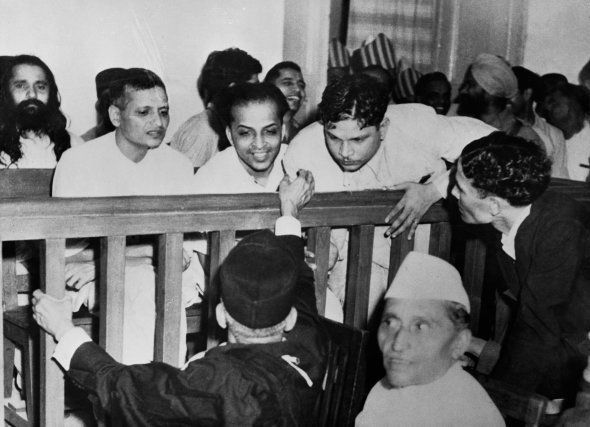 Some of the accused talk to their defense attorneys before their trial for the assassination of Mahatma Gandhi.