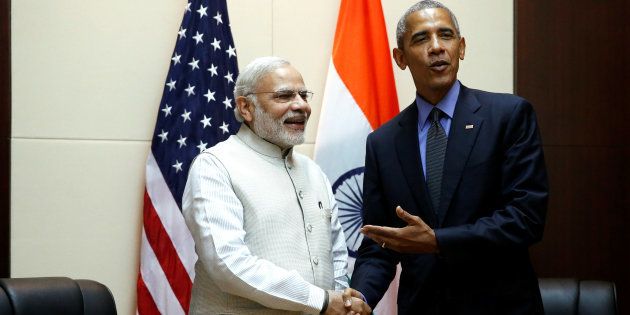 U.S. President Barack Obama stands for a handshake with India's Prime Minister Narendra Modi before their bilateral meeeting alongside the ASEAN Summits in Vientiane, Laos September 8, 2016.