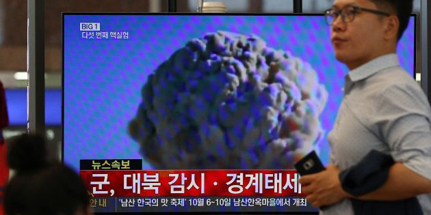 A man walks past a television screen showing a news broadcast on North Korea's nuclear test at Gimhae International Airport in Busan, South Korea, on Friday, Sept. 9, 2016. North Korea conducted its fifth nuclear test on Friday, the anniversary of the reclusive nation's founding, and said it was now able to produce miniaturized nuclear arms. Photographer: SeongJoon Cho/Bloomberg via Getty Images
