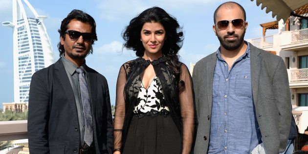 Nawazuddin Siddiqui, Nimrat Kaur and director Ritesh Batra attend the 'Lunchbox' photocall during day six of the 10th Annual Dubai International Film Festival held at the Madinat Jumeriah Complex on December 11, 2013 in Dubai. (Photo by Gareth Cattermole/Getty Images for DIFF)