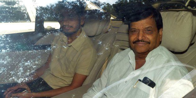 NEW DELHI, INDIA - SEPTEMBER 14: Uttar Pradesh Minister and Samajwadi party leader Shivpal Yadav with his son Aditya Yadav arrive during a high-level meeting with his brother and Samajwadi party Chief Mulayam Singh Yadav at Mulayam's house, on September 14, 2016 in New Delhi, India. UP CM Akhilesh Yadav stripped his uncle, Shivpal Singh Yadav, of three key ministerial berths late on Tuesday, in signs of growing fissures within Uttar Pradesh's ruling Samajwadi Party ahead of next year's assembly elections. (Photo by Sonu Mehta/Hindustan Times via Getty Images)