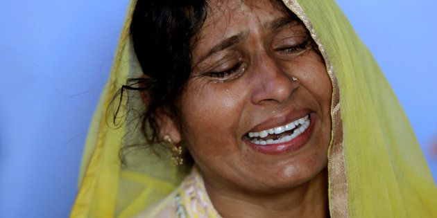 Geeta, wife of Ravi Paul, an Indian army soldier who was killed in Sunday's attack at an Indian army base in Kashmir's Uri, mourns at her house in Sarwa village in Samba district, south of Jammu, September 19, 2016.