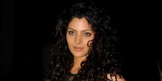 Indian model Saiyami Kher attends the 'Society Young Achiever Awards' 2013 in Mumbai on October 19, 2013. AFP PHOTO (Photo credit should read STR/AFP/Getty Images)