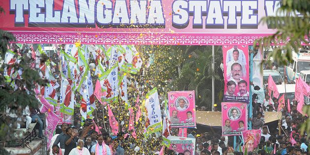 File photo of Telangana Rashtra Samiti (TRS) party president K. Chandrasekhar Rao and other officials riding on a truck during a victory procession for the formation of a separate Telangana state in Hyderabad on February 26, 2014.