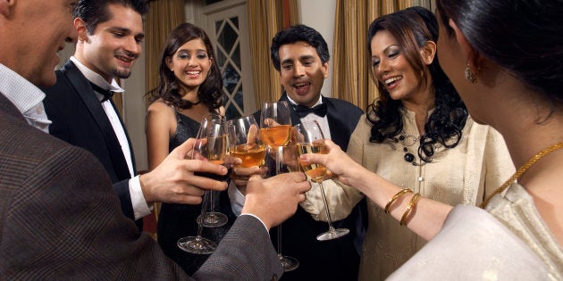 Dinner Guests Toasting Glasses