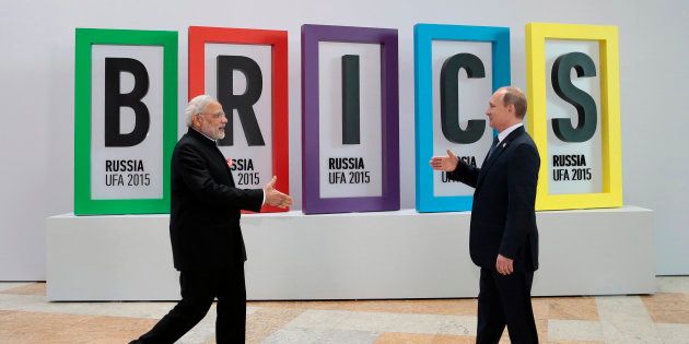 In this July 9, 2015, file photo, Indian Prime Minister Narendra Modi, left, and Russian President Vladimir Putin prepare to shake hands prior to their talks during the BRICS Summit in Ufa, Russia.