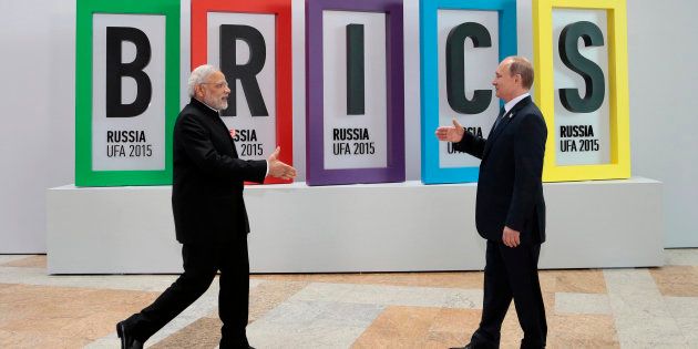 FILE - In this July 9, 2015, file photo, Indian Prime Minister Narendra Modi, left, and Russian President Vladimir Putin prepare to shake hands prior to their talks during the BRICS Summit in Ufa, Russia.