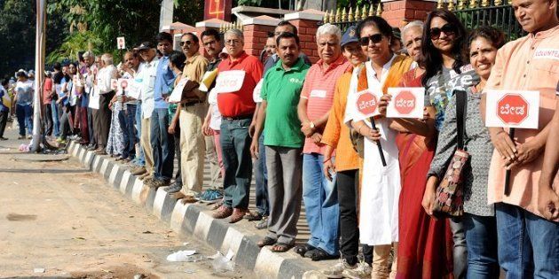 Bengaluru residents form human chain against the construction of a steel flyover.