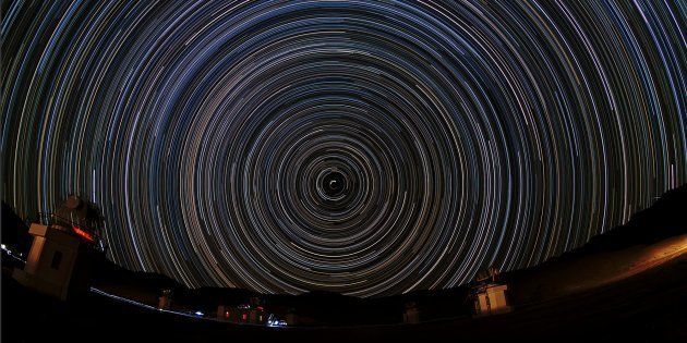 Nearly a complete night (about 8 hours) of Indian Himalayas is captured in this polar star trail image looking toward the north celestial pole. In the foreground the High Altitude Gamma Ray Telescope Array, located at an altitude of 4270 metres near Hanle in Ladakh.