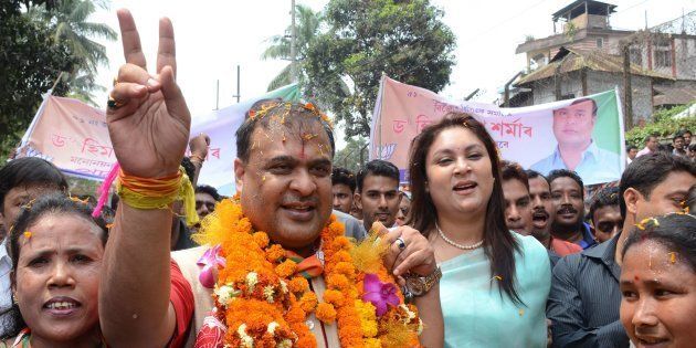 Indian candidate Himanta Biswa Sarma (2nd L) of the BJP is accompanied by supporters on the way to file nomination papers from Jalukbari Assembly Constituency in Guwahati on March 21 2016.