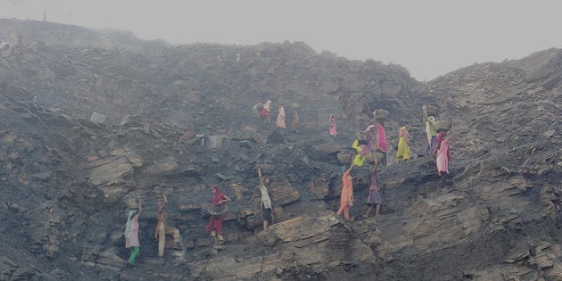 Coal scavengers work very early in the morning before the mine officials come inside the mines in Jharia.