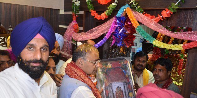 BJP leader Arun Jaitley and Punjab Cabinet Minister Bikram Singh Majithia offer prayer at Chavinda Devi Temple in Majitha.