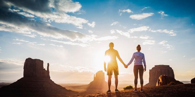 Couple holding hands in Monument Valley