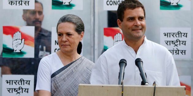 File photo of Congress party vice-president Rahul Gandhi with his mother and chief of Congress Sonia Gandhi (L).
