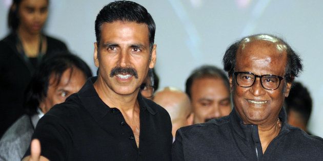 Indian Bollywood actors Akshay Kumar (L) and Rajinikanth pose for a photograph during a promotional event for the forthcoming science fiction Hindi film '2.O' written and directed by S. Shankar in Mumbai on November 20, 2016.