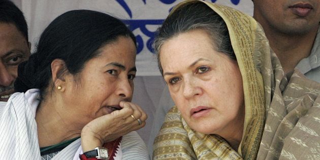 File photo of India's Congress party president Sonia Gandhi (R) and Mamata Banerjee from the Trinamool Congress (TMC) party.