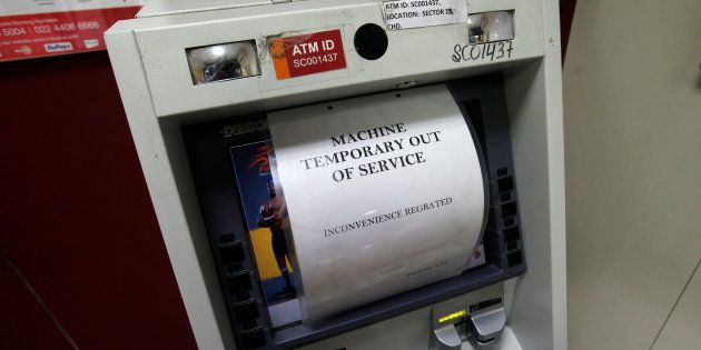 A notice is displayed on an ATM machine which is no longer dispensing cash in Chandigarh
