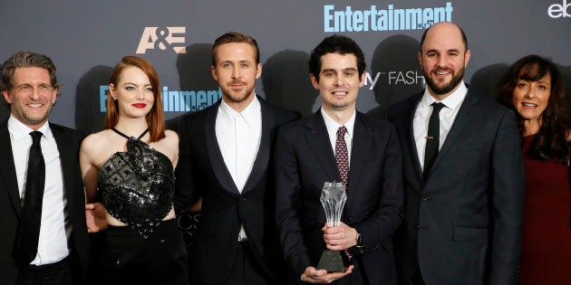 (L-R) Producer Gary Gilbert, actors Emma Stone and Ryan Gosling, director Damien Chazelle, producer Jordan Horowitz and costume designer Mary Zophres pose backstage with their award for Best Picture for 'La La Land