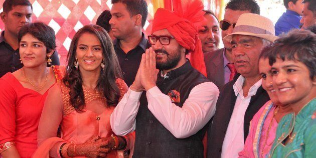 [File photo] Aamir Khan with Mahavir Singh Phogat and his family during the wedding function of Olympian wrestler Geeta.