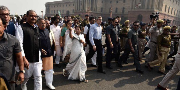 TMC leader and West Bengal Chief Minister Mamata Banerjee and former J&K CM Omar Abdullah lead a delegation of MPs from opposition parties in a protest march from Parliament to Rashtrapati Bhavan against demonetisation.
