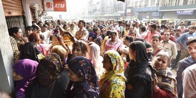 People in queue outside a bank to deposit and exchange 500 and 1000 currency notes at Paharganj.