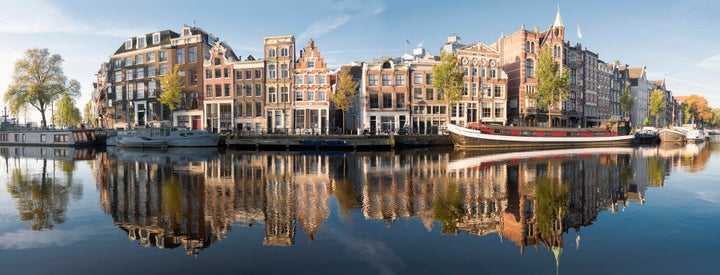 Amstel river panorama in Amsterdam. Shot on a clear autumn morning with no winds.