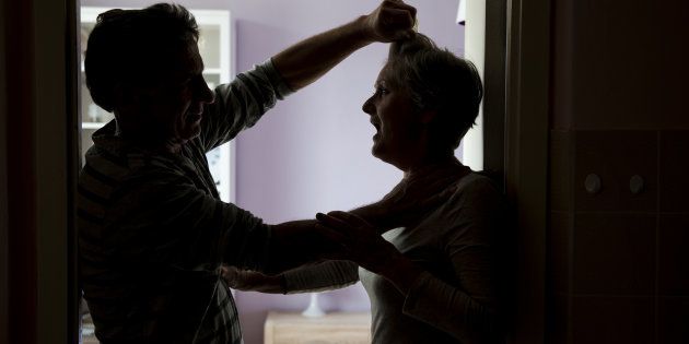Silhouette of a couple fighting, woman is the victim of domestic violence.