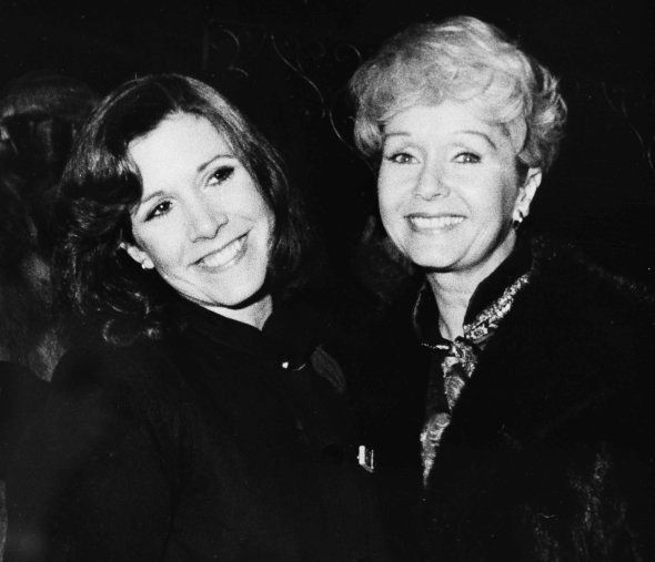 Actress Carrie Fisher, left, with her mother Debbie Reynolds.