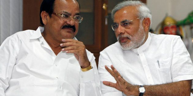 Venkaiah Naidu (L) and Narendra Modi at a meeting in New Delhi May 18, 2009. REUTERS/Adnan Abidi